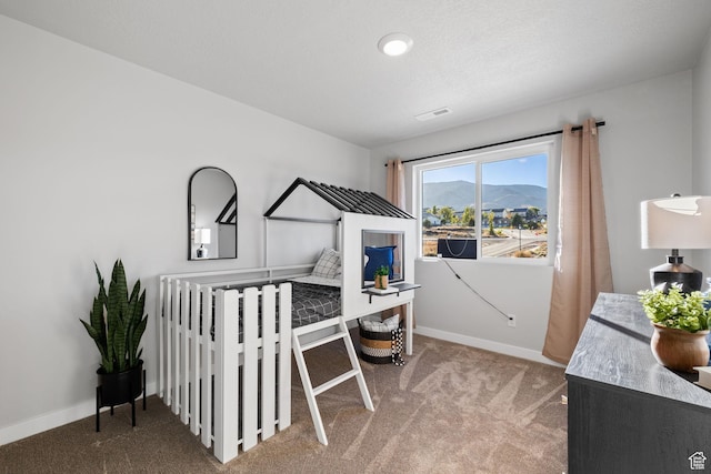199 N Mia Cv E Unit 12, Saratoga Springs, UT 84045 - carpeted bedroom with baseboards and a mountain view