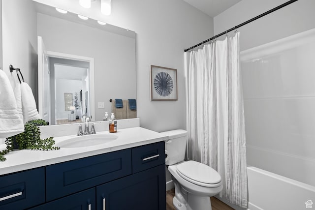 199 N Mia Cv E Unit 12, Saratoga Springs, UT 84045 - bathroom with vanity, toilet, shower / bathtub combination with curtain, and wood finished floors