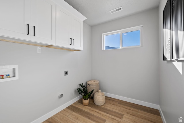 199 N Mia Cv E Unit 12, Saratoga Springs, UT 84045 - laundry area with hookup for an electric dryer, cabinet space, baseboards, light wood-style floors, and washer hookup