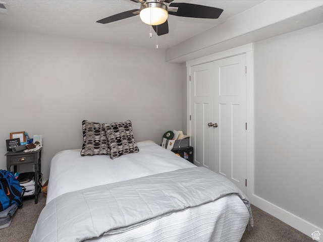 131 Crockett Ave, Logan, UT 84321 - carpeted bedroom featuring a closet, ceiling fan, and baseboards