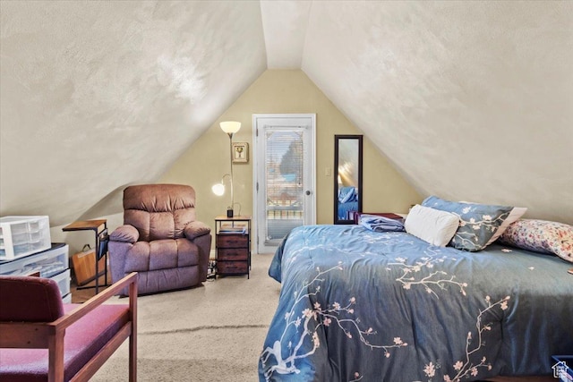 carpeted bedroom featuring access to exterior and lofted ceiling