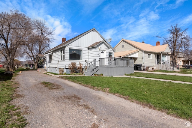 268 S Main St, Malad City, ID 83252 - view of side of home featuring a yard, driveway, and a chimney