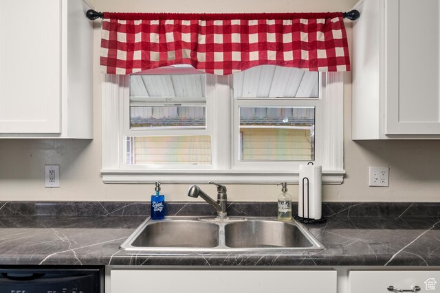 268 S Main St, Malad City, ID 83252 - kitchen featuring dishwasher, a sink, white cabinets, and dark countertops