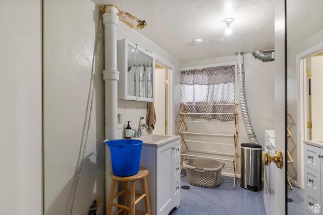 268 S Main St, Malad City, ID 83252 - bathroom with vanity and a textured ceiling