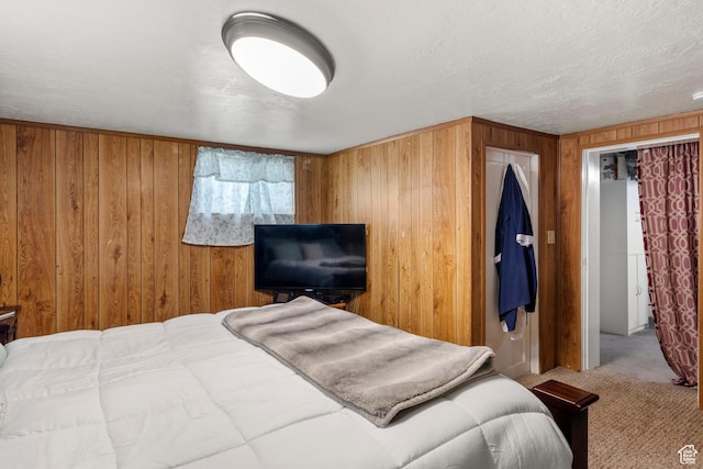 268 S Main St, Malad City, ID 83252 - carpeted bedroom with wood walls and a textured ceiling