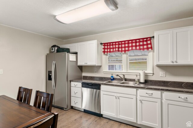 268 S Main St, Malad City, ID 83252 - kitchen with appliances with stainless steel finishes, a sink, white cabinets, and dark countertops