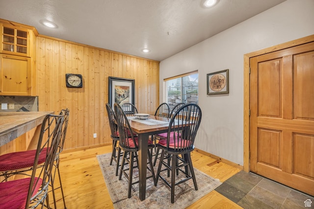 5424 Bobsled Blvd Unit T2, Park City, UT 84098 - dining space featuring wooden walls, baseboards, and light wood-type flooring
