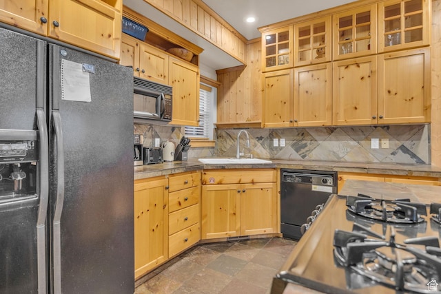 5424 Bobsled Blvd Unit T2, Park City, UT 84098 - kitchen featuring glass insert cabinets, black appliances, a sink, decorative backsplash, and tile counters