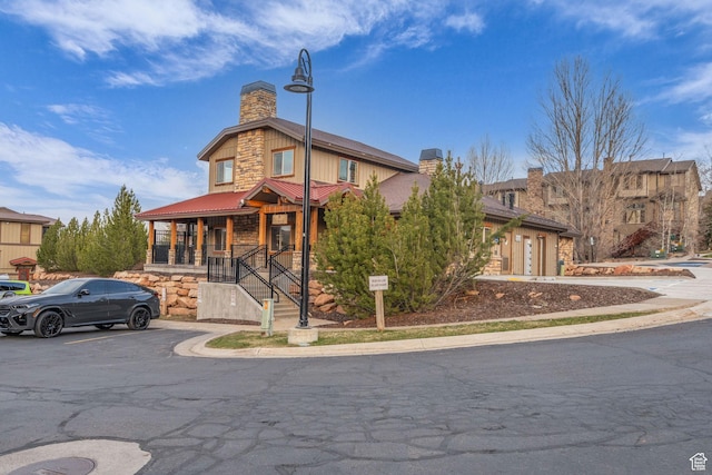 5424 Bobsled Blvd Unit T2, Park City, UT 84098 - view of front of property with metal roof, stone siding, and a chimney