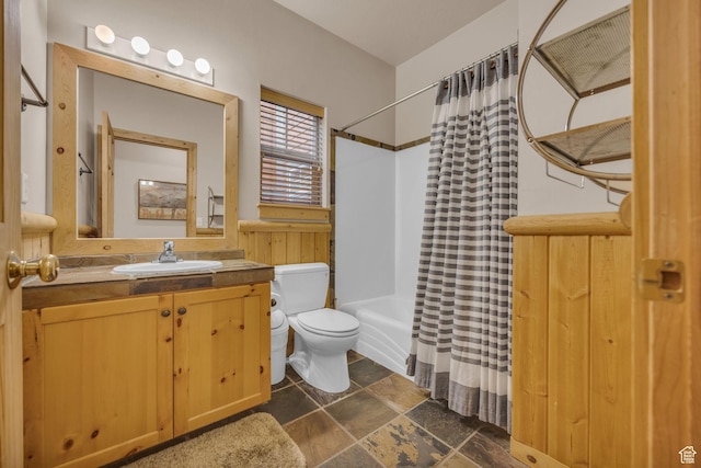 5424 Bobsled Blvd Unit T2, Park City, UT 84098 - bathroom with shower / bath combo, toilet, stone finish floor, and vanity