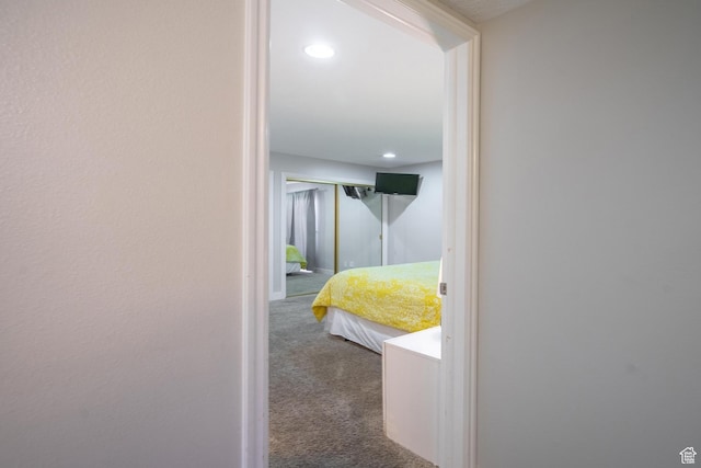 hallway featuring recessed lighting and carpet floors