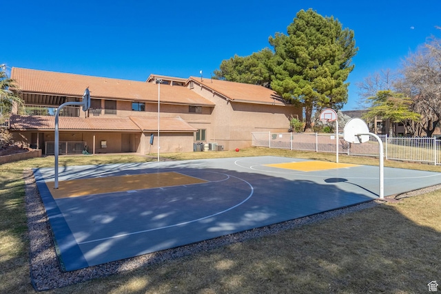 view of basketball court with fence and community basketball court