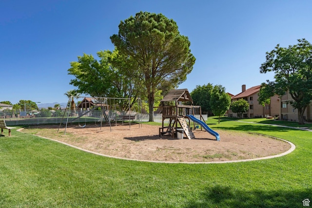 community playground with fence and a yard
