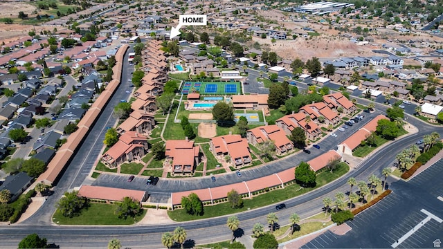 birds eye view of property with a residential view