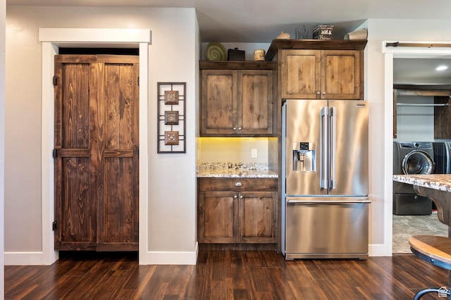 5185 N 600 E, Enoch, UT 84721 - kitchen featuring dark wood finished floors, light stone countertops, high end refrigerator, washer / dryer, and baseboards