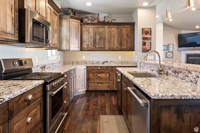 5185 N 600 E, Enoch, UT 84721 - kitchen with appliances with stainless steel finishes, light stone counters, dark wood finished floors, pendant lighting, and a sink