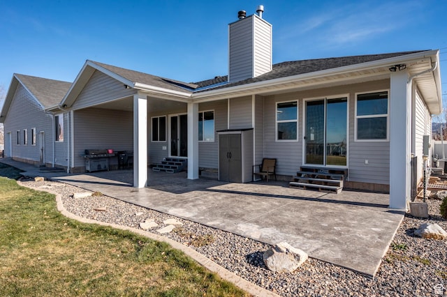 5185 N 600 E, Enoch, UT 84721 - rear view of property with a patio area, entry steps, a chimney, and a shingled roof