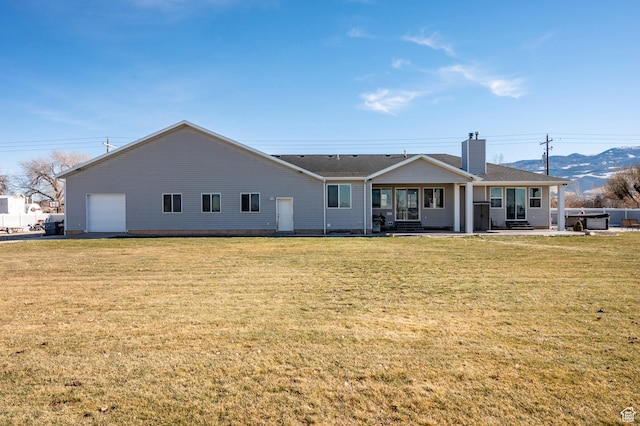 5185 N 600 E, Enoch, UT 84721 - back of house with roof with shingles, a chimney, and a lawn