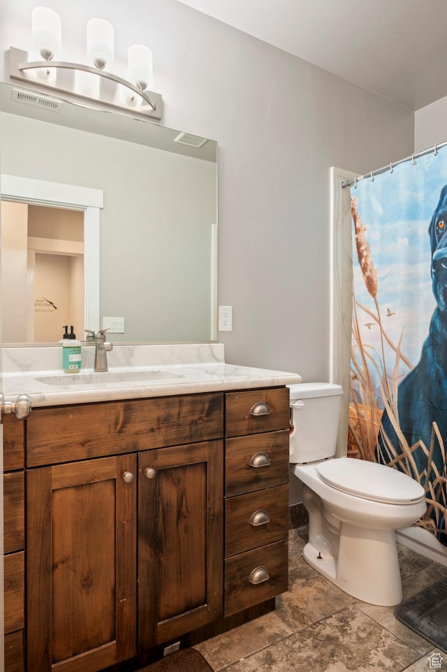 5185 N 600 E, Enoch, UT 84721 - bathroom with visible vents, toilet, vanity, and a shower with curtain
