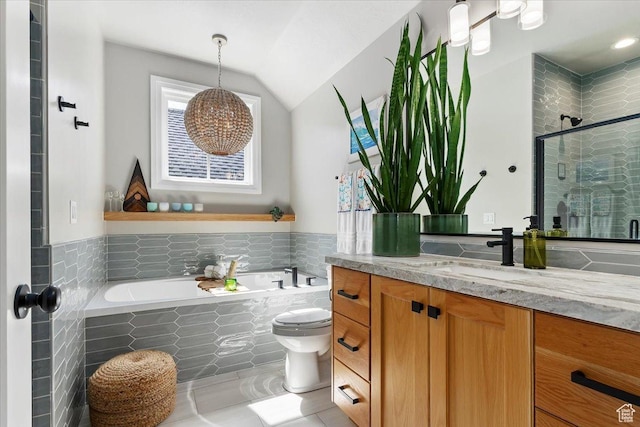 bathroom with vanity, a stall shower, tile patterned flooring, lofted ceiling, and a garden tub