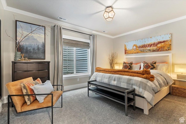 bedroom featuring visible vents, baseboards, crown molding, and carpet floors