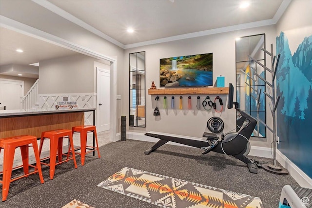 exercise area with crown molding, baseboards, and recessed lighting