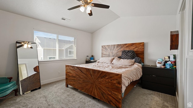 bedroom featuring baseboards, vaulted ceiling, visible vents, ceiling fan, and carpet