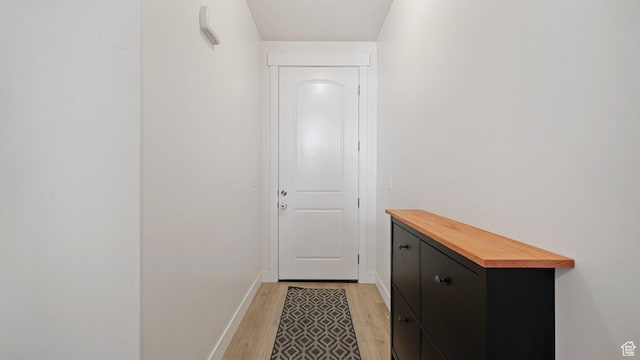 entryway featuring light wood-type flooring and baseboards