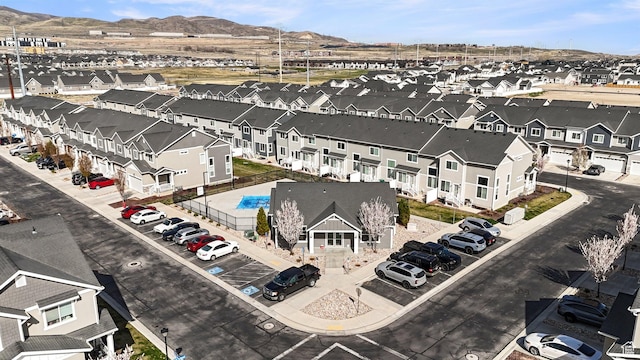 birds eye view of property featuring a mountain view and a residential view