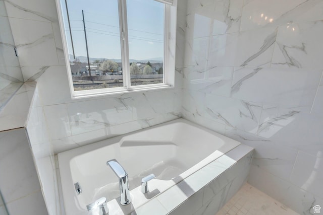 full bath with a tub to relax in