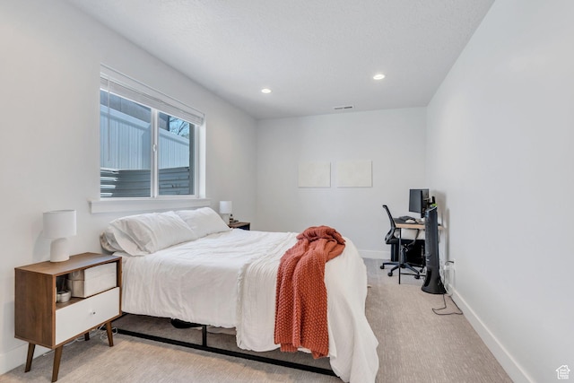 bedroom with recessed lighting, visible vents, baseboards, and light colored carpet