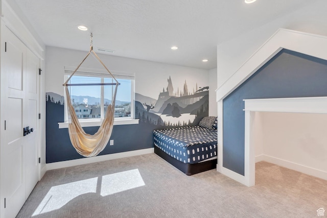 carpeted bedroom with recessed lighting, visible vents, and baseboards