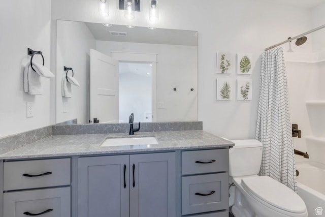 bathroom featuring toilet, visible vents, shower / tub combo with curtain, and vanity