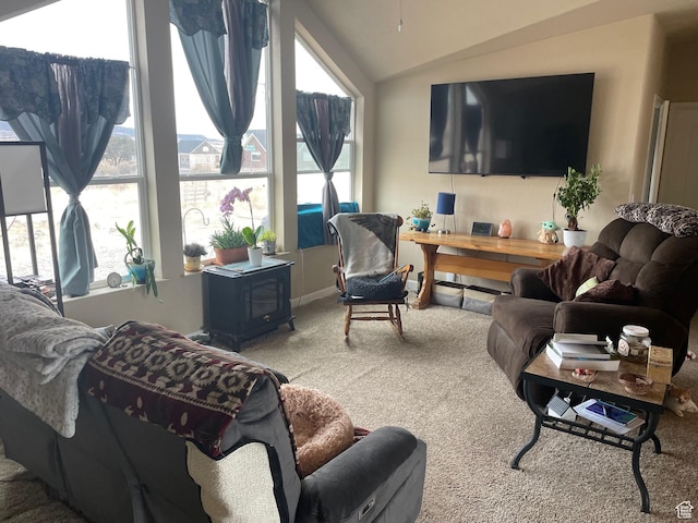 living area with vaulted ceiling and carpet flooring