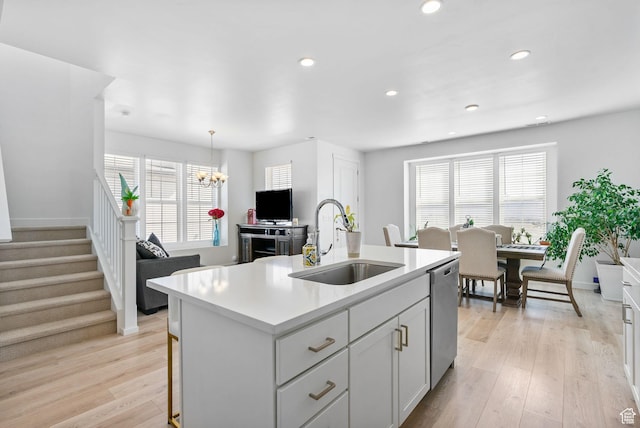 11612 S Watercourse Rd W, South Jordan, UT 84009 - kitchen with a sink, light countertops, light wood-style floors, recessed lighting, and stainless steel dishwasher