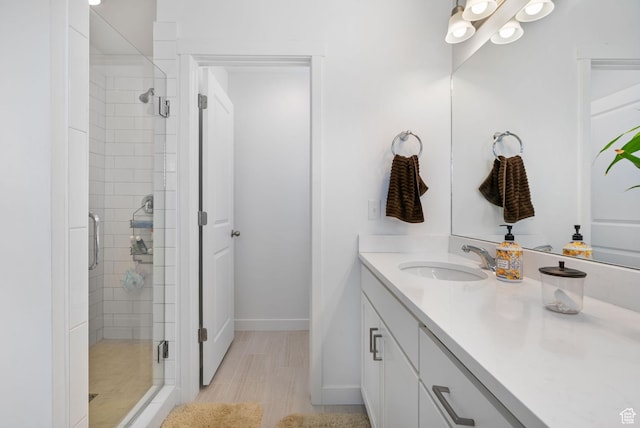 11612 S Watercourse Rd W, South Jordan, UT 84009 - bathroom with a shower stall, vanity, and baseboards