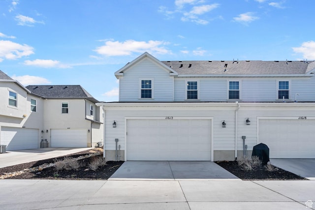 11612 S Watercourse Rd W, South Jordan, UT 84009 - view of front of house with an attached garage and concrete driveway