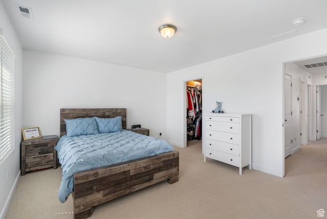 11612 S Watercourse Rd W, South Jordan, UT 84009 - bedroom with a spacious closet, visible vents, light colored carpet, and baseboards