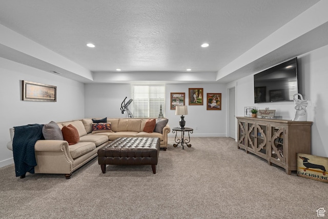 living area featuring baseboards, recessed lighting, light colored carpet, and a textured ceiling