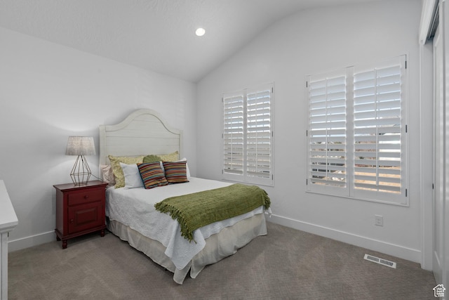 bedroom featuring baseboards, multiple windows, carpet flooring, and vaulted ceiling