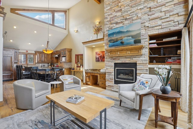 1335 Deer Valley Dr S, Park City, UT 84060 - living room featuring a high ceiling, light wood-style floors, and a fireplace