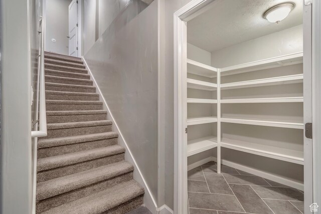 15191 S Ronaldo Ln, Herriman, UT 84096 - staircase with tile patterned flooring and baseboards