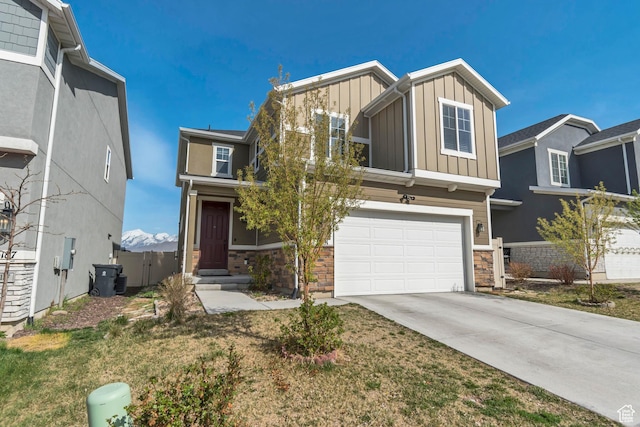 15191 S Ronaldo Ln, Herriman, UT 84096 - view of front of home featuring driveway, board and batten siding, stone siding, an attached garage, and central AC