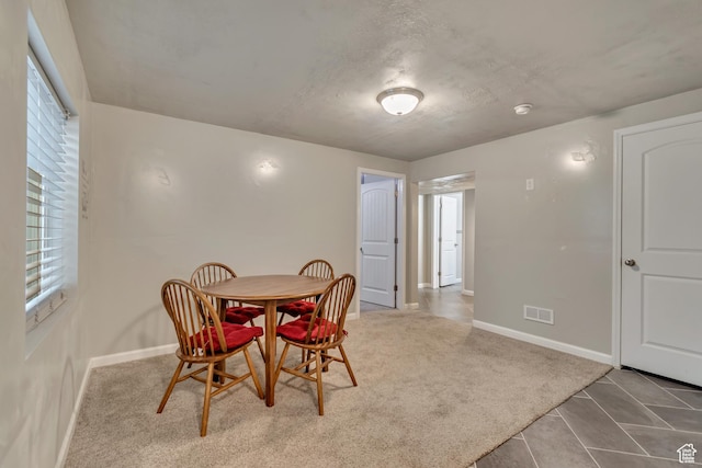 15191 S Ronaldo Ln, Herriman, UT 84096 - carpeted dining area featuring baseboards, tile patterned flooring, and visible vents