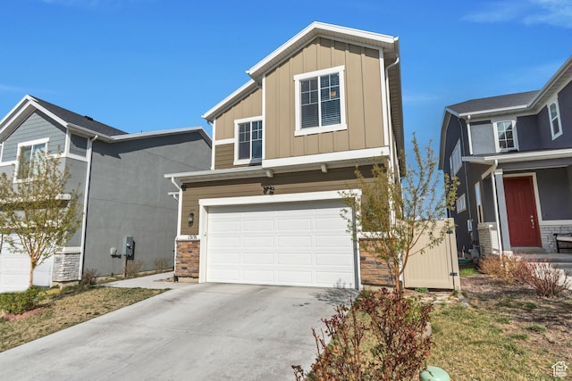 15191 S Ronaldo Ln, Herriman, UT 84096 - view of front of house with an attached garage, board and batten siding, and concrete driveway