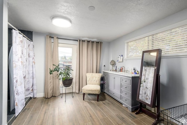 1171 E Hyland Lake Dr S, Murray, UT 84121 - living area with wood finished floors and a textured ceiling