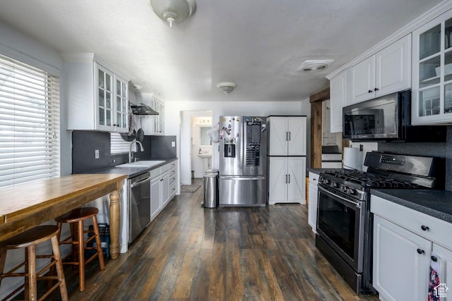 1171 E Hyland Lake Dr S, Murray, UT 84121 - kitchen with glass insert cabinets, white cabinetry, a sink, stainless steel appliances, and dark wood-style floors