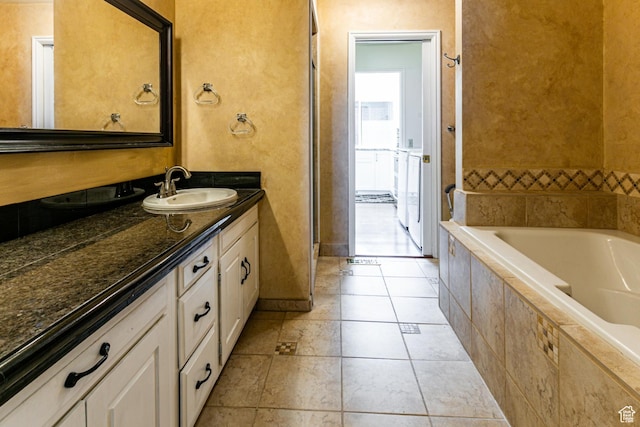 1357 E Ridgewood Ln S, Bountiful, UT 84010 - full bathroom featuring tile patterned floors, vanity, baseboards, and tiled bath