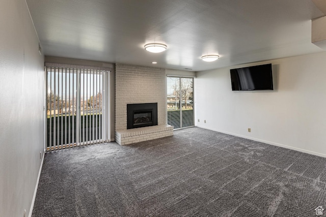 1357 E Ridgewood Ln S, Bountiful, UT 84010 - unfurnished living room with baseboards, dark colored carpet, and a fireplace