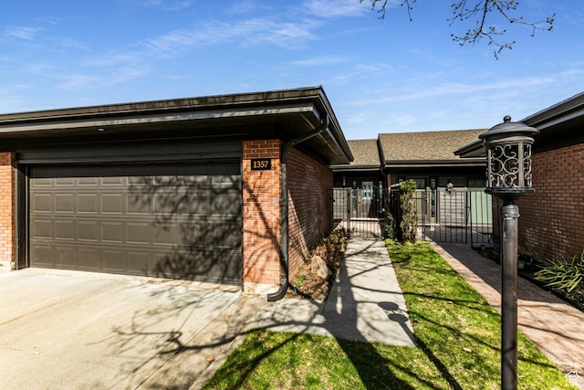 1357 E Ridgewood Ln S, Bountiful, UT 84010 - exterior space featuring brick siding, an attached garage, fence, and concrete driveway